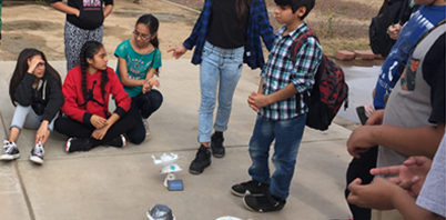 Students build amusement parks powered by solar panels.